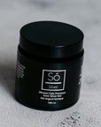 A black jar of Só Silver Mission Falls Premium Ionic Silver Gel, 100 ml, set on a textured light gray surface.